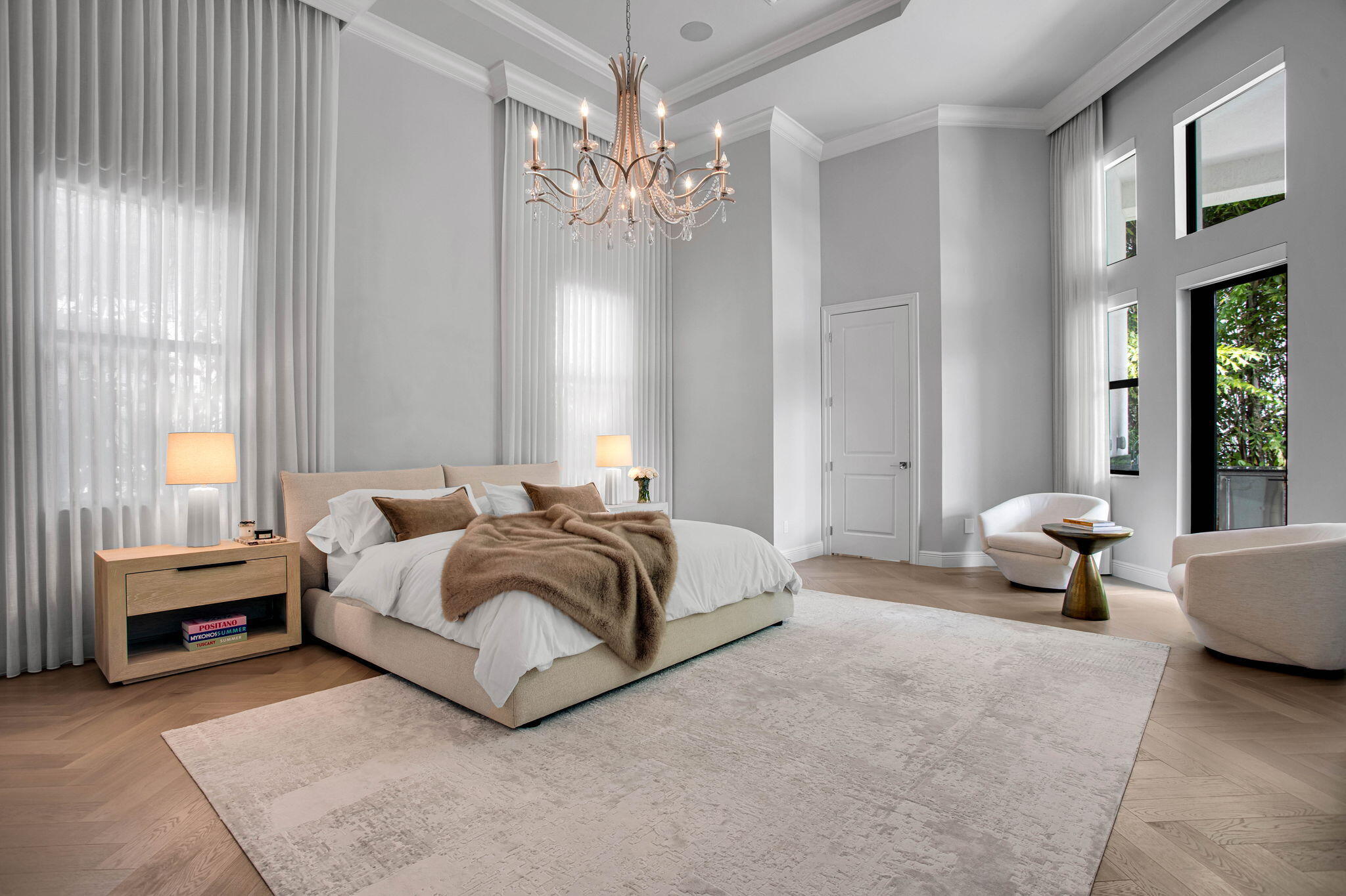 6903 Northwest 28th Avenue Boca Raton, FL 33496 - Photo 19 of 55 a spacious bedroom with a bed and a chandelier
