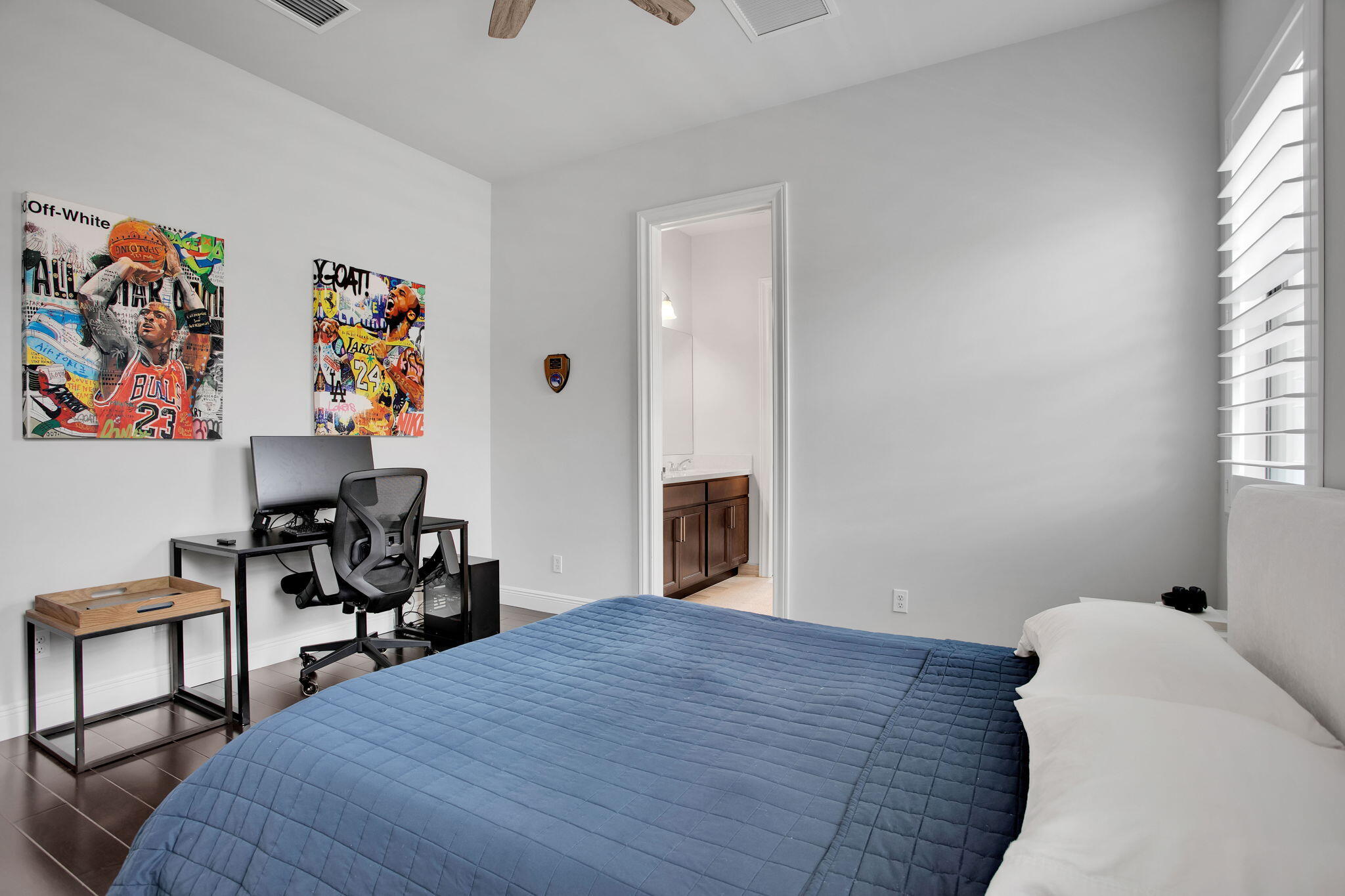 6903 Northwest 28th Avenue Boca Raton, FL 33496 - Photo 44 of 55 a bedroom with a bed and a window