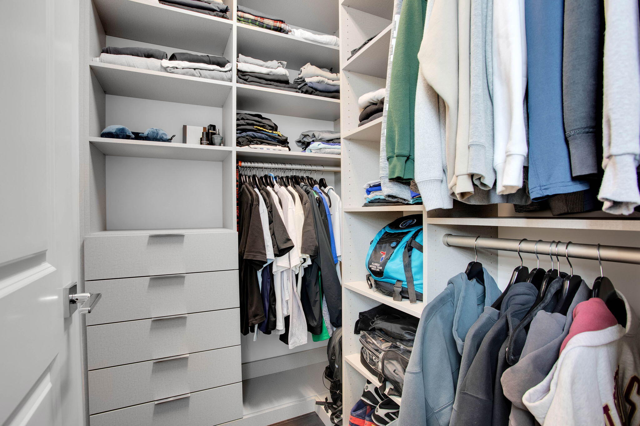 6903 Northwest 28th Avenue Boca Raton, FL 33496 - Photo 45 of 55 a view of walk in closet with clothes and shoes