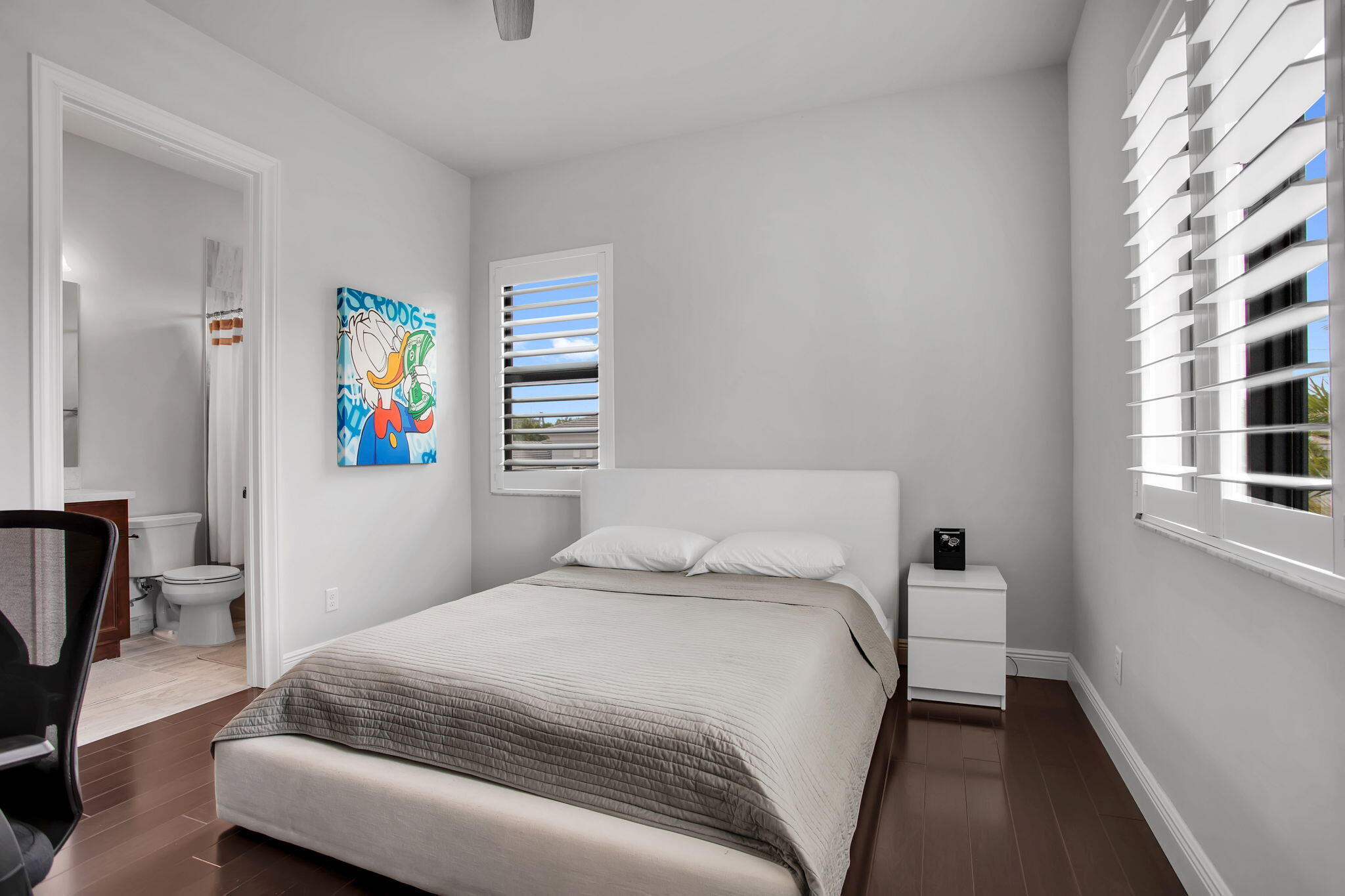 6903 Northwest 28th Avenue Boca Raton, FL 33496 - Photo 46 of 55 a bedroom with a bed and a couch