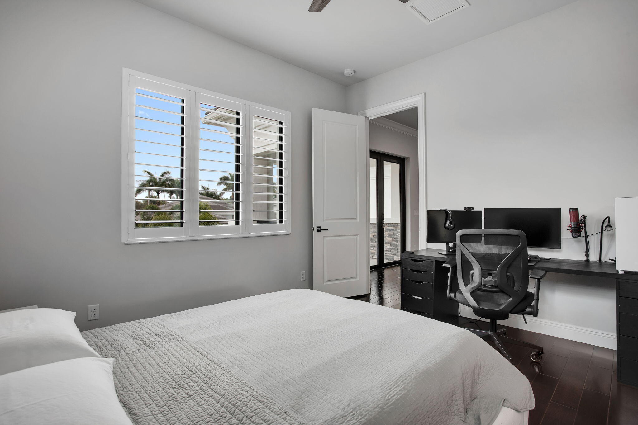 6903 Northwest 28th Avenue Boca Raton, FL 33496 - Photo 48 of 55 a bedroom with a bed and furniture