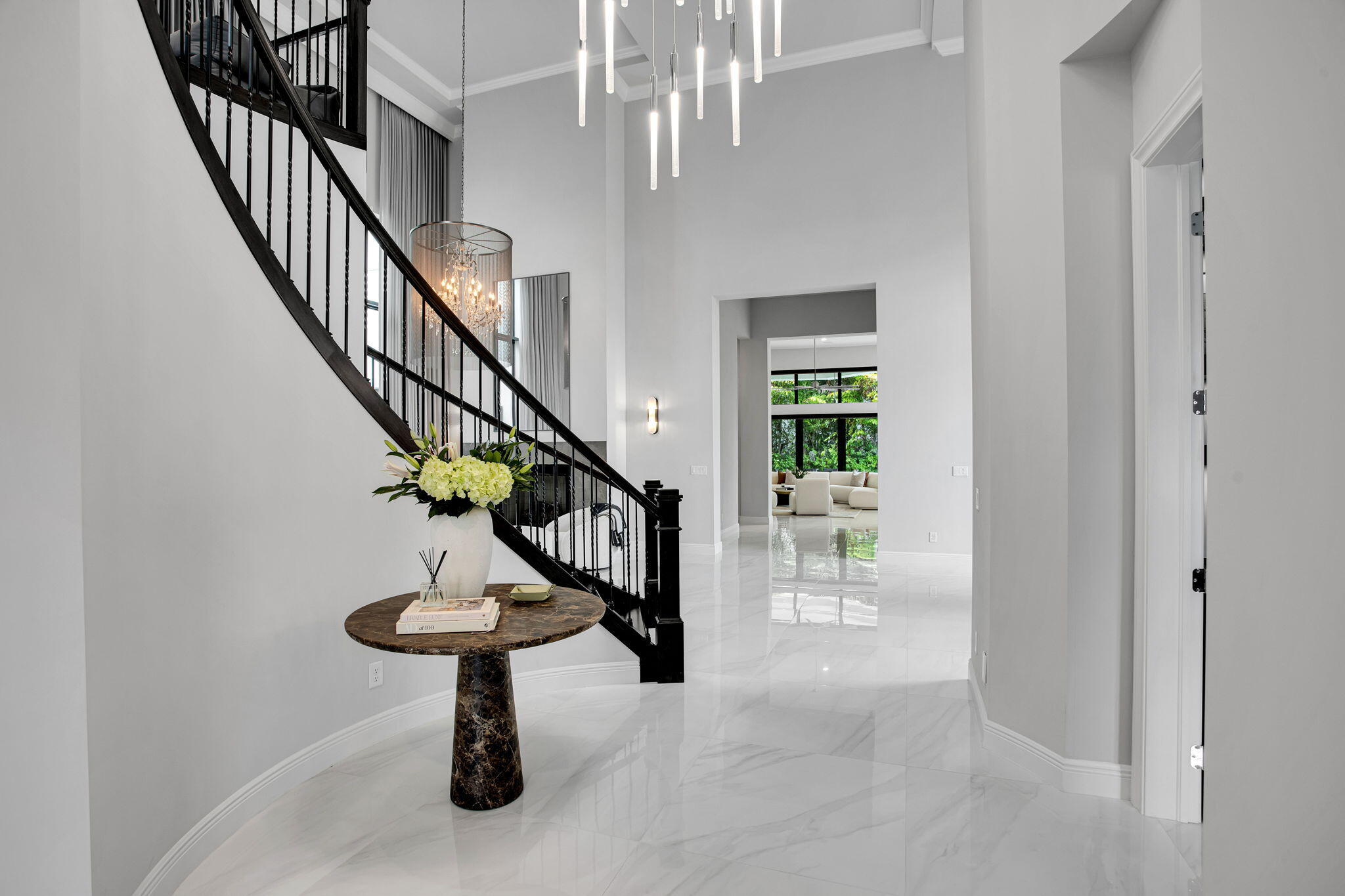 6903 Northwest 28th Avenue Boca Raton, FL 33496 - Photo 7 of 55 a view of entryway and hall with a dining room
