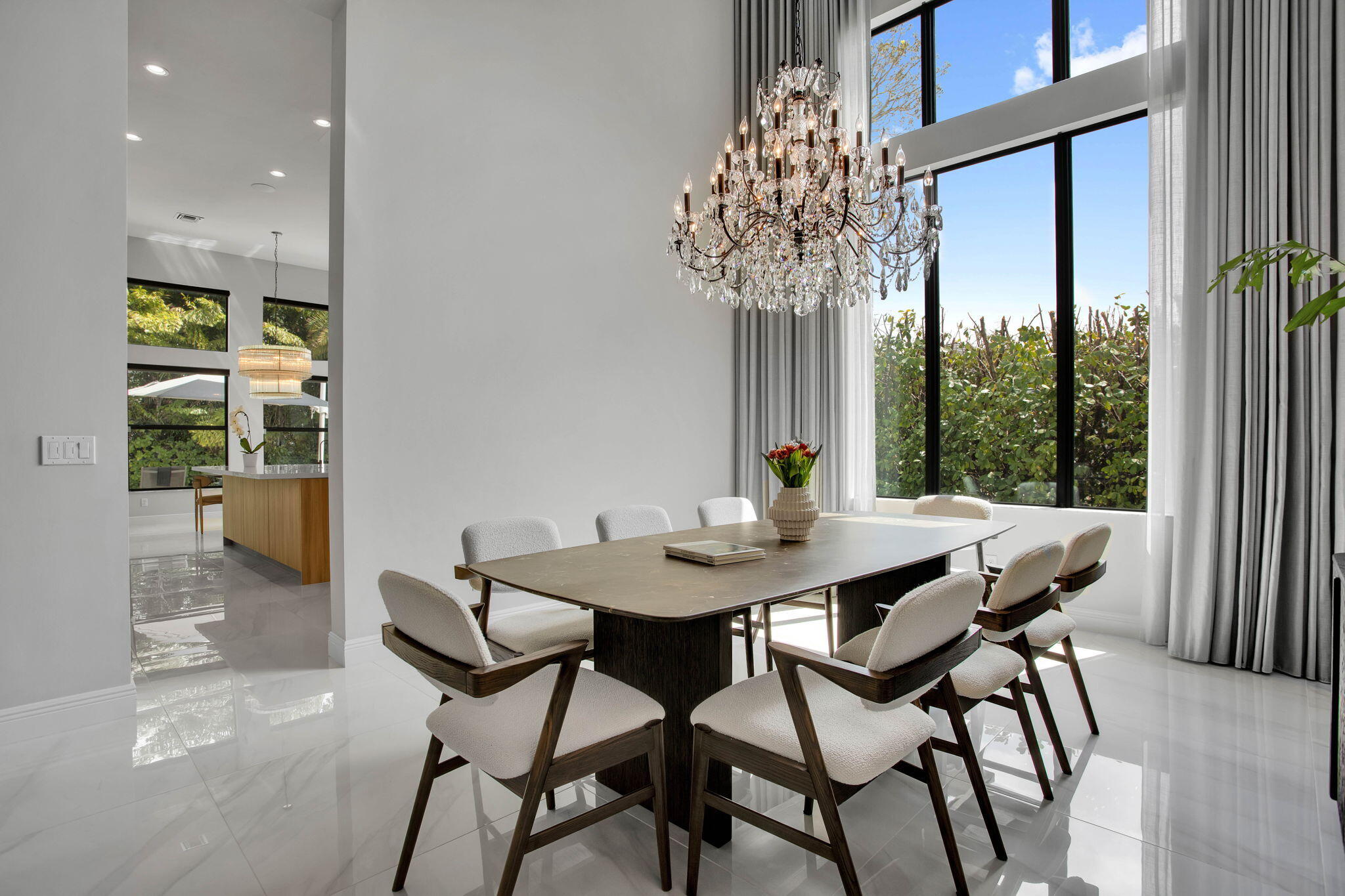6903 Northwest 28th Avenue Boca Raton, FL 33496 - Photo 8 of 55 a view of a dining room with furniture and chandelier