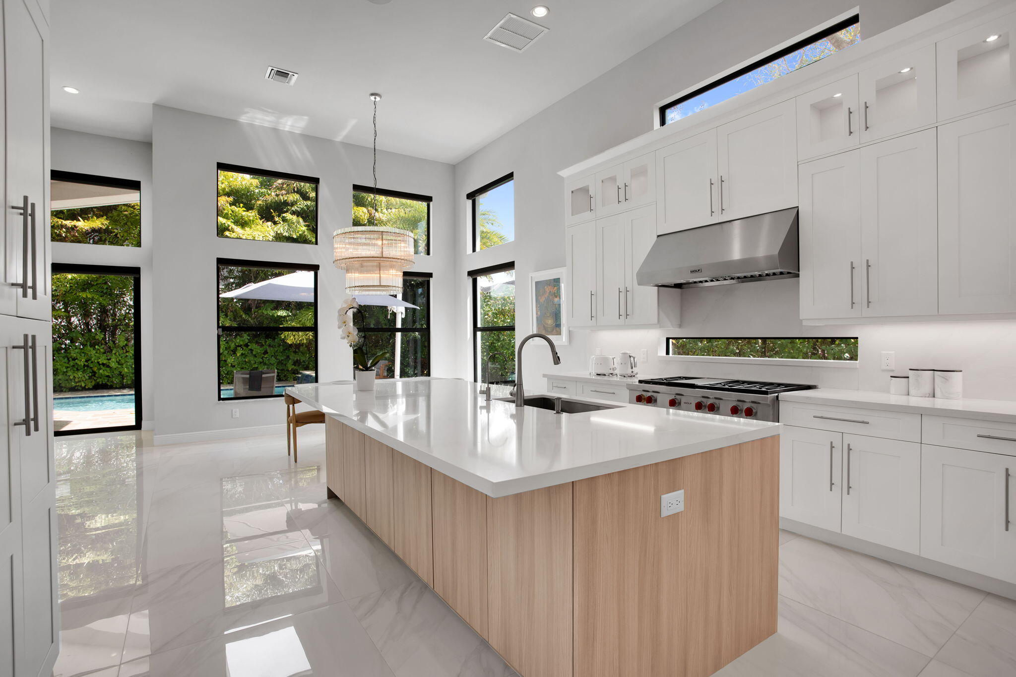 6903 Northwest 28th Avenue Boca Raton, FL 33496 - Photo 9 of 55 a kitchen with stainless steel appliances granite countertop a sink and a stove
