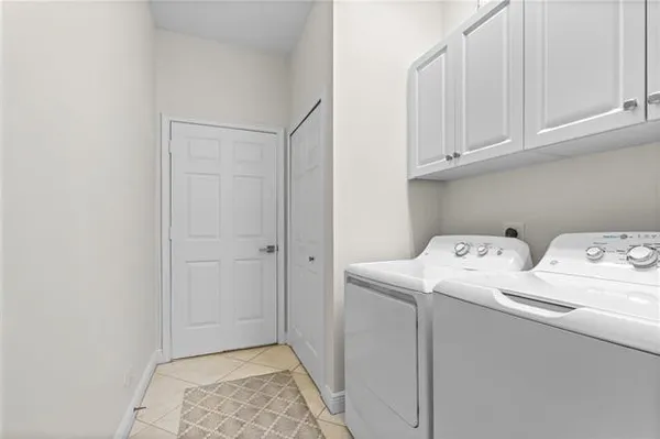 a view of storage and utility room with washer and dryer