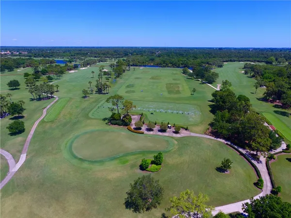 an aerial view of a golf course with a garden