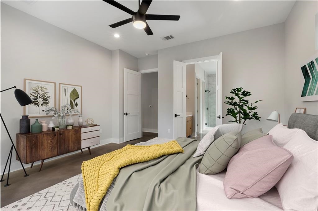 1107 Stobaugh Street, Unit 1 Austin, TX 78757 - Photo 11 of 27 a bedroom with a bed couch and window