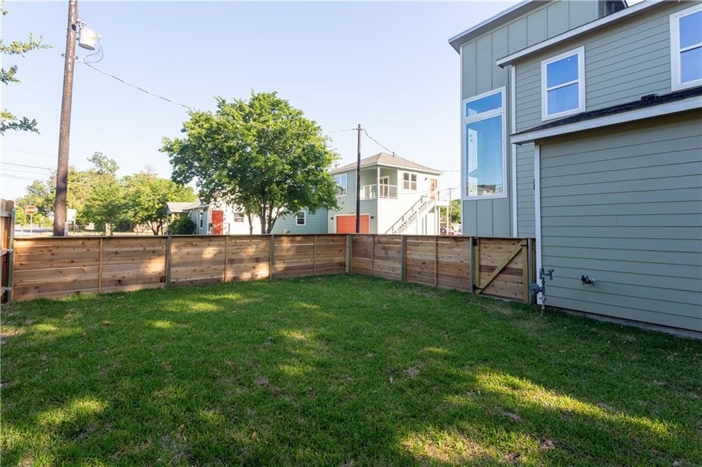 1107 Stobaugh Street, Unit 1 Austin, TX 78757 - Photo 4 of 27 a view of yard with green space