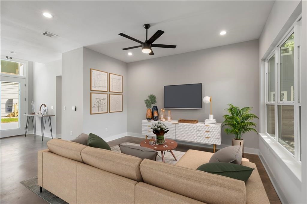 1107 Stobaugh Street, Unit 1 Austin, TX 78757 - Photo 7 of 27 a living room with furniture and a large window