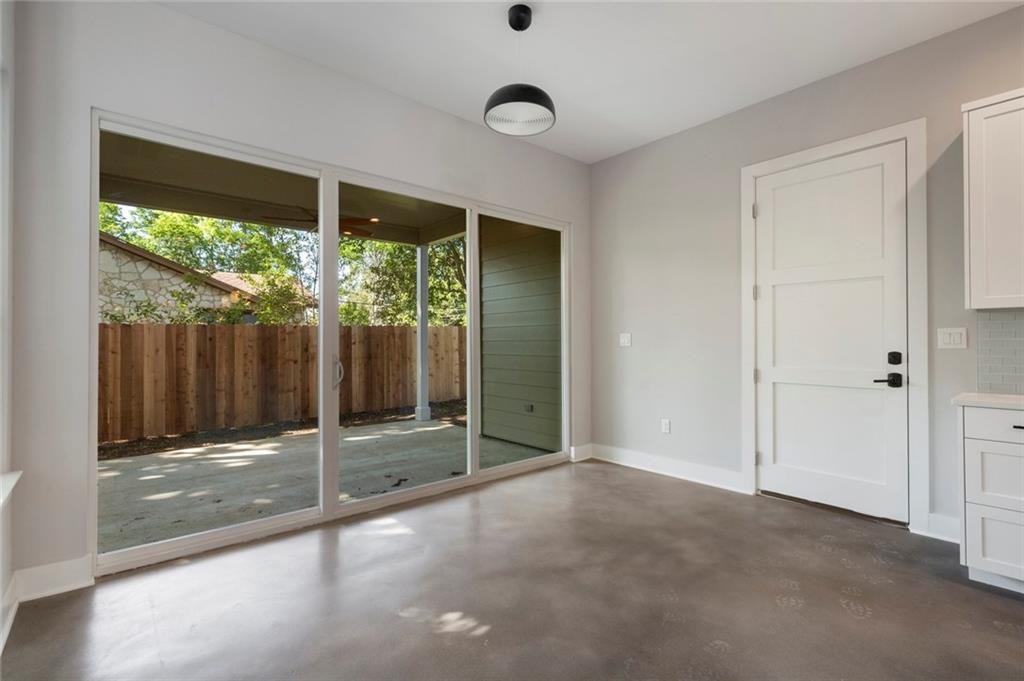 1107 Stobaugh Street, Unit 1 Austin, TX 78757 - Photo 9 of 27 a view of an empty room and window