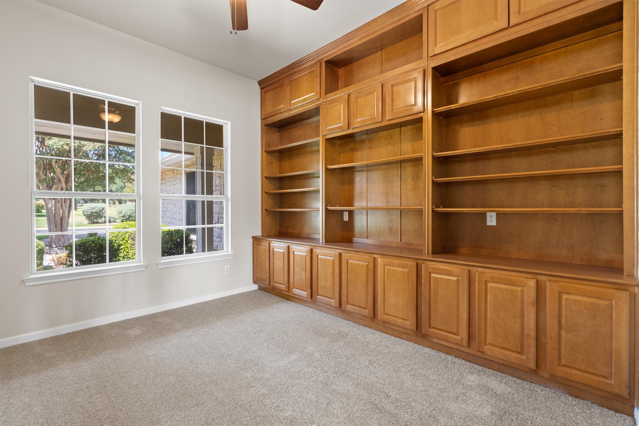 108 Cattle Trail Way Georgetown, TX 78633 - Photo 19 of 40 So much storage with built-in bookshelves.