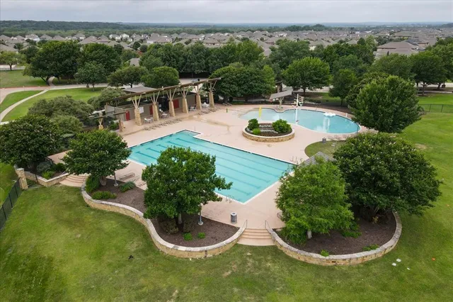 a house with swimming pool and garden