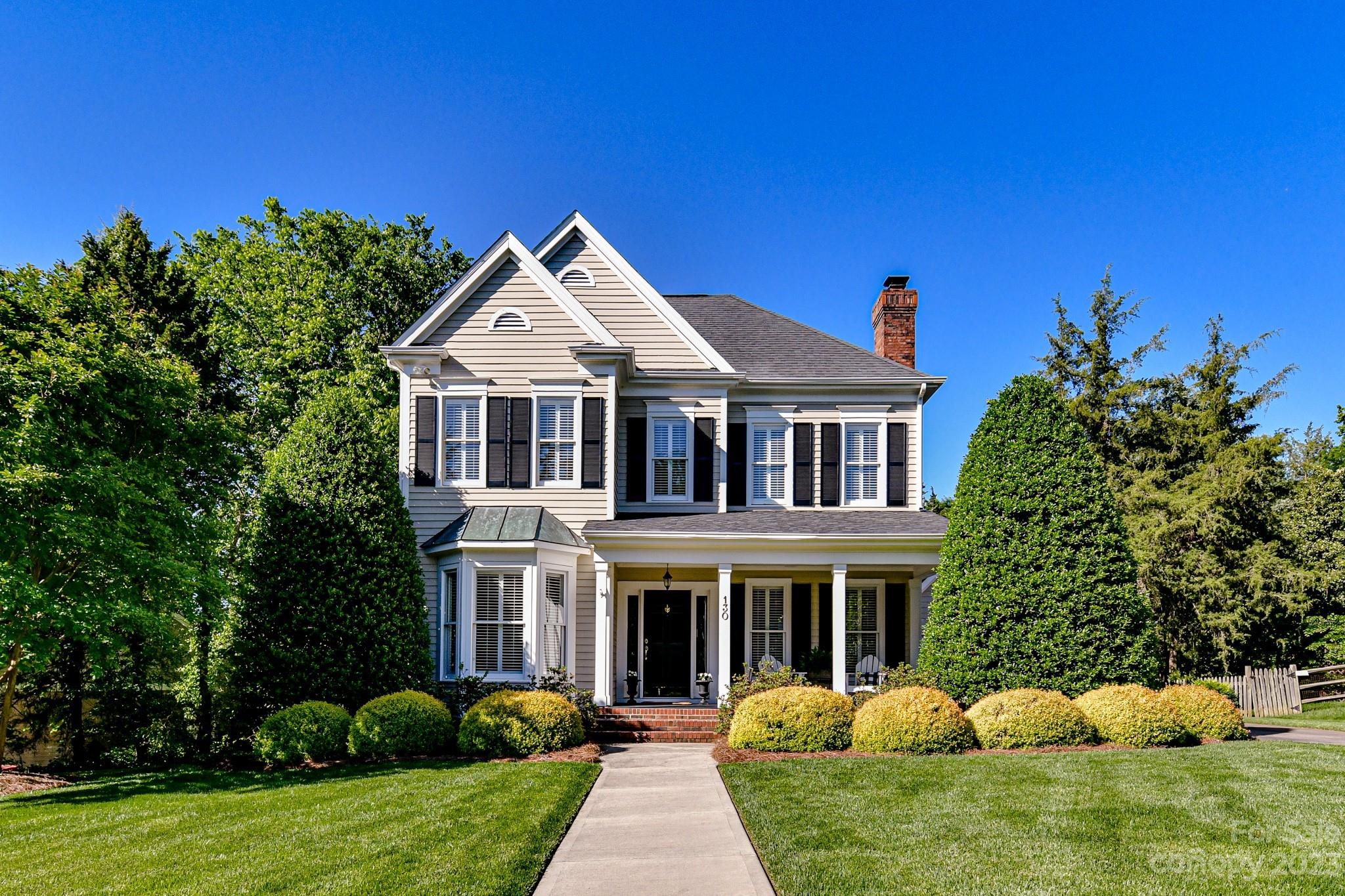 130 Morrison Hill Road Davidson, NC 28036 - Photo 1 of 29 a front view of a house with a garden