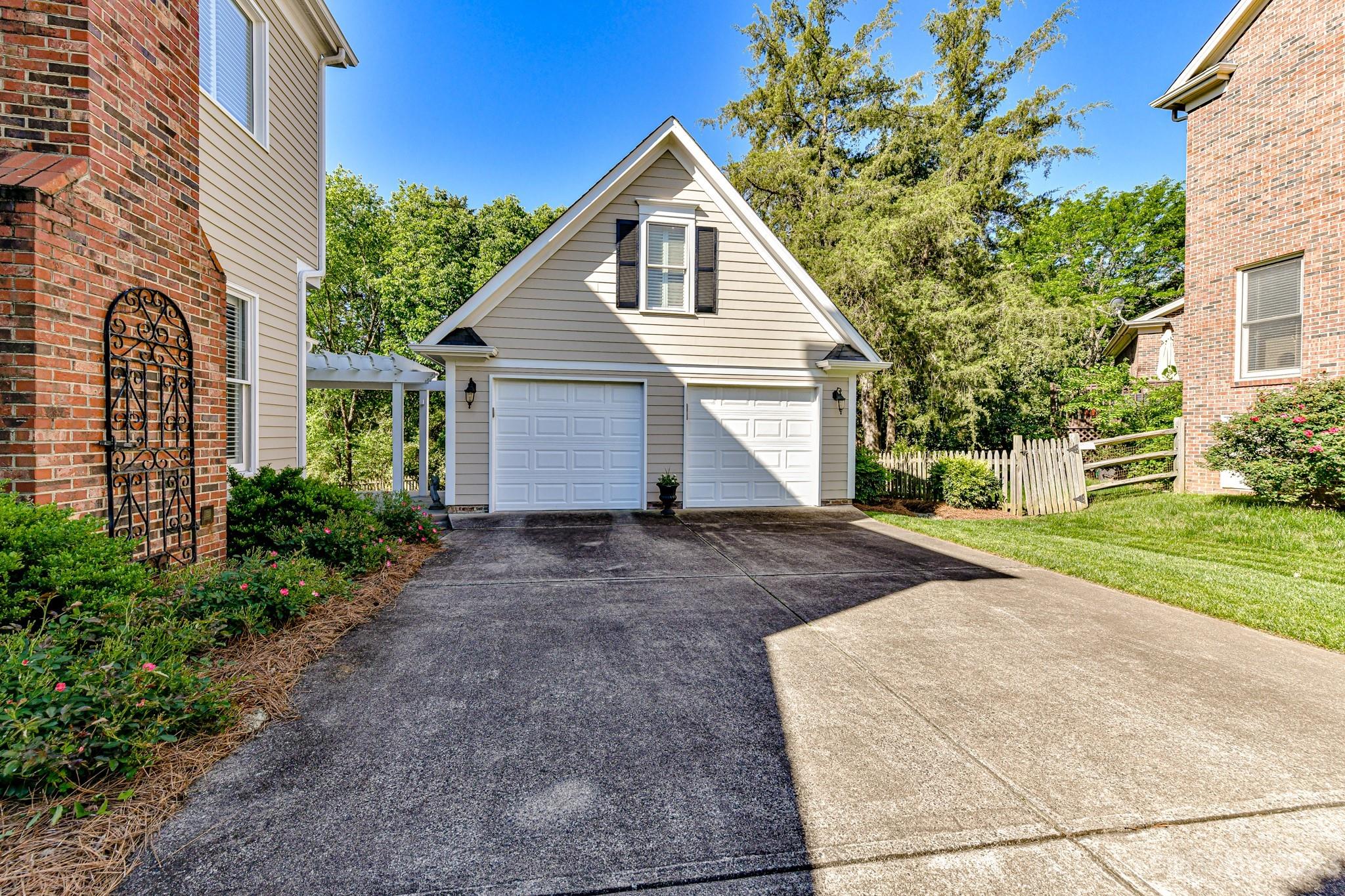 130 Morrison Hill Road Davidson, NC 28036 - Photo 28 of 29 a front view of a house with a yard and garage