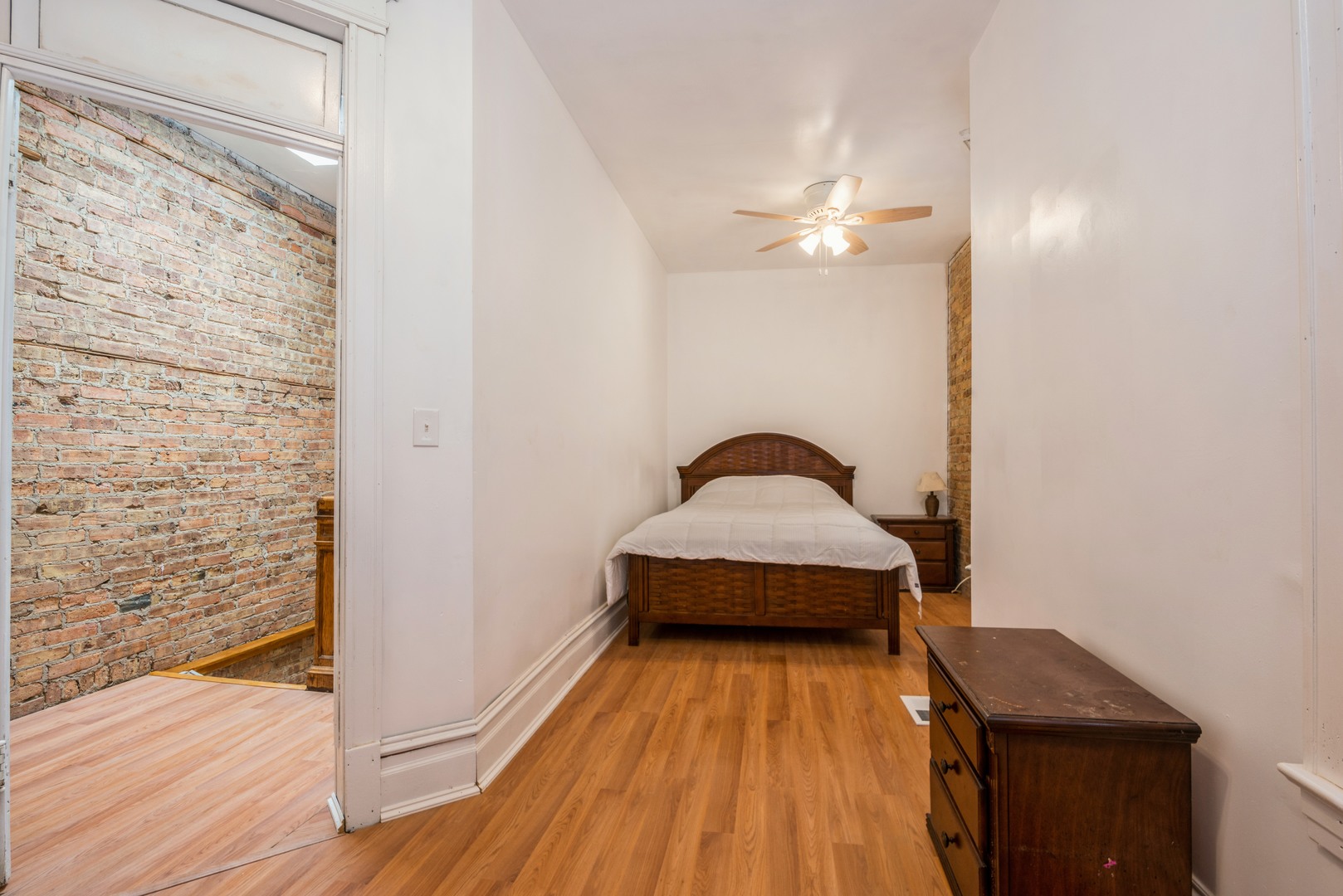 4937 South Prairie Avenue Chicago, IL 60615 - Photo 7 of 15 a view of a bedroom with wooden floor
