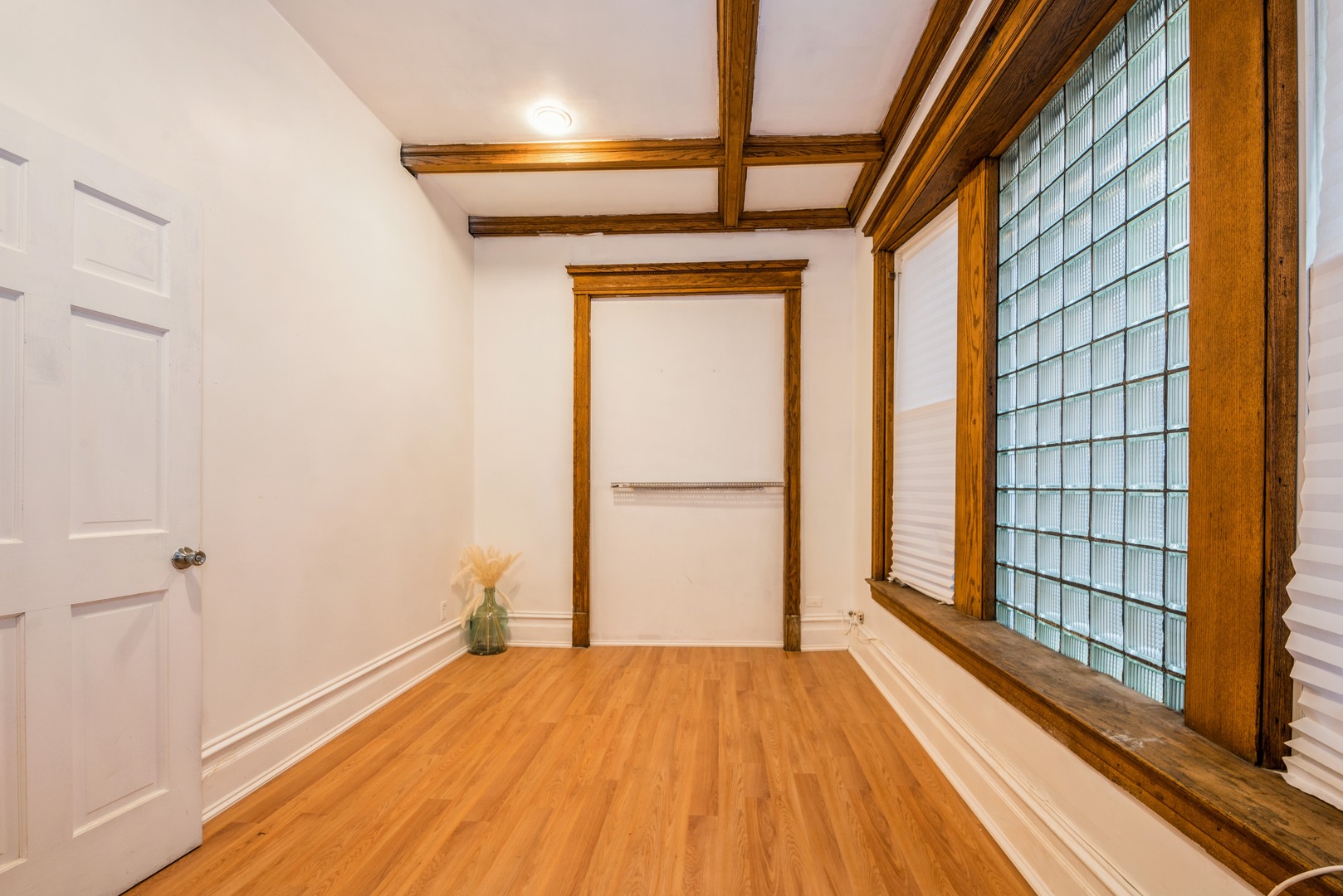 4937 South Prairie Avenue Chicago, IL 60615 - Photo 8 of 15 a view of empty room with wooden floor and fan