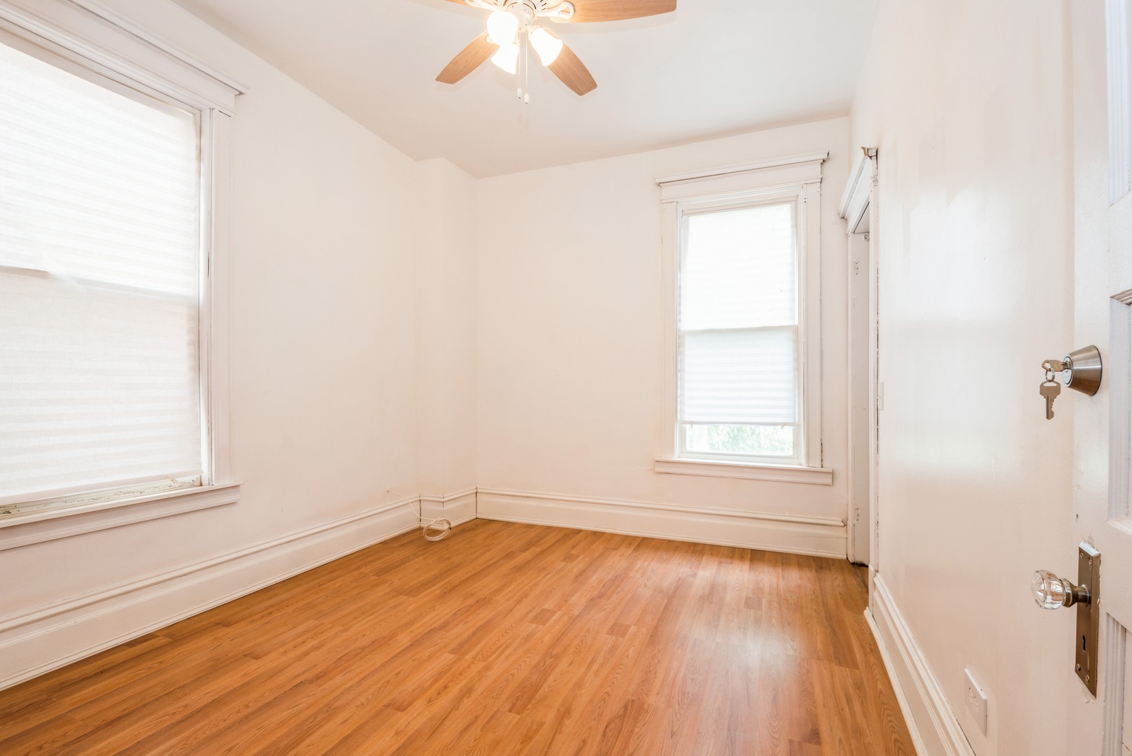4937 South Prairie Avenue Chicago, IL 60615 - Photo 9 of 15 wooden floor in an empty room with a window