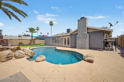 a view of a house with swimming pool