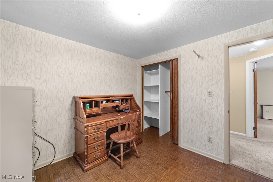 648 Rehwinkle Road Northfield, OH 44067 - Photo 20 of 38 Bedroom / office space featuring a textured ceiling and wallpapered walls