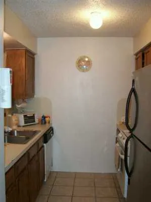 a kitchen with a sink and a stove