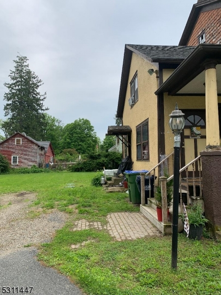917 Main Street Newton, NJ 07860 - Photo 6 of 14 a front view of a house with a yard