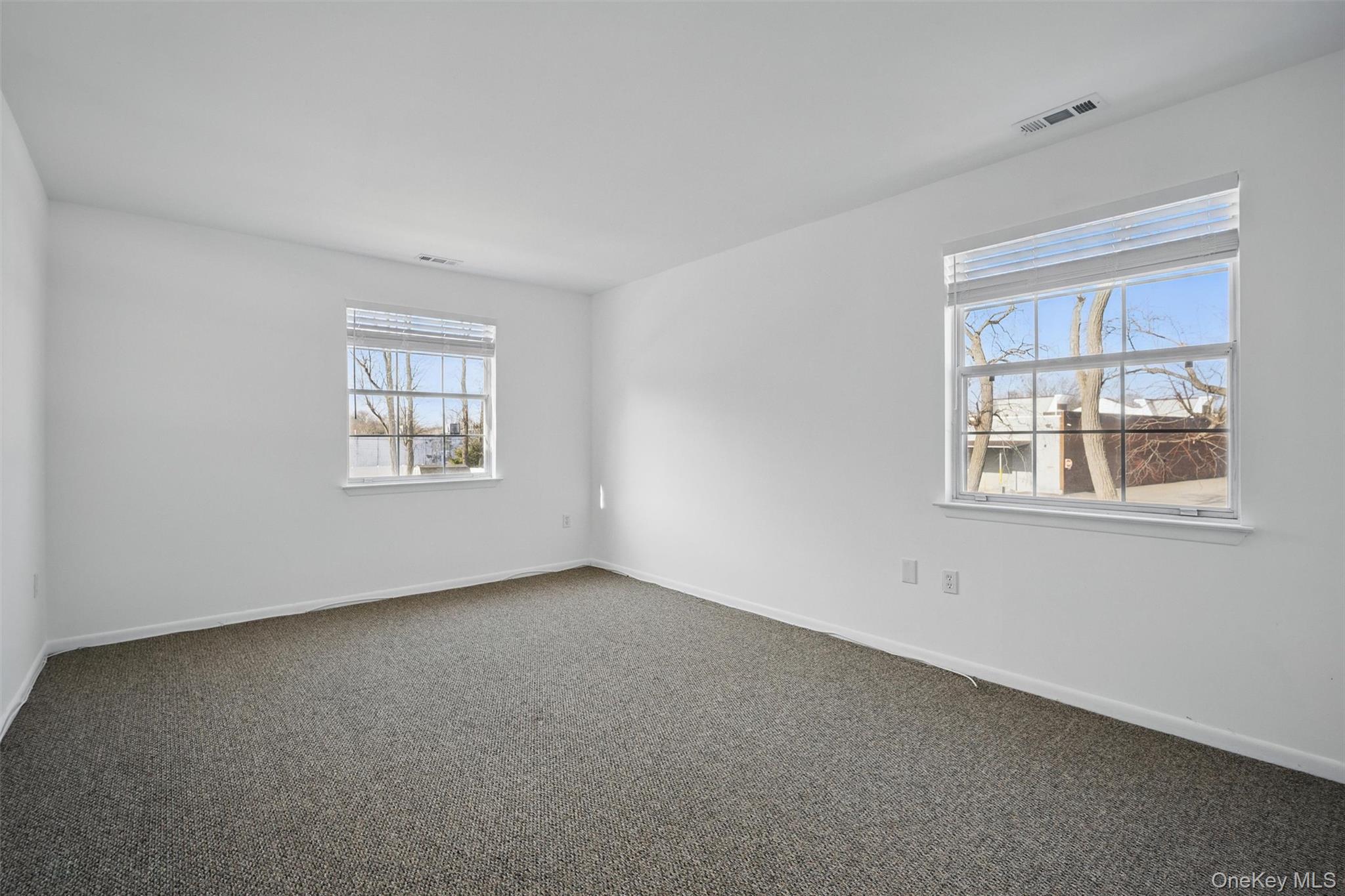 201 Commons Way, Unit E Fishkill, NY 12524 - Photo 20 of 30 an empty room with windows