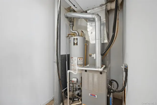 view of a hallway with wooden floor and entryway