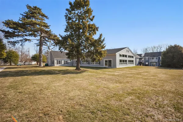 a house with swimming pool in front of it