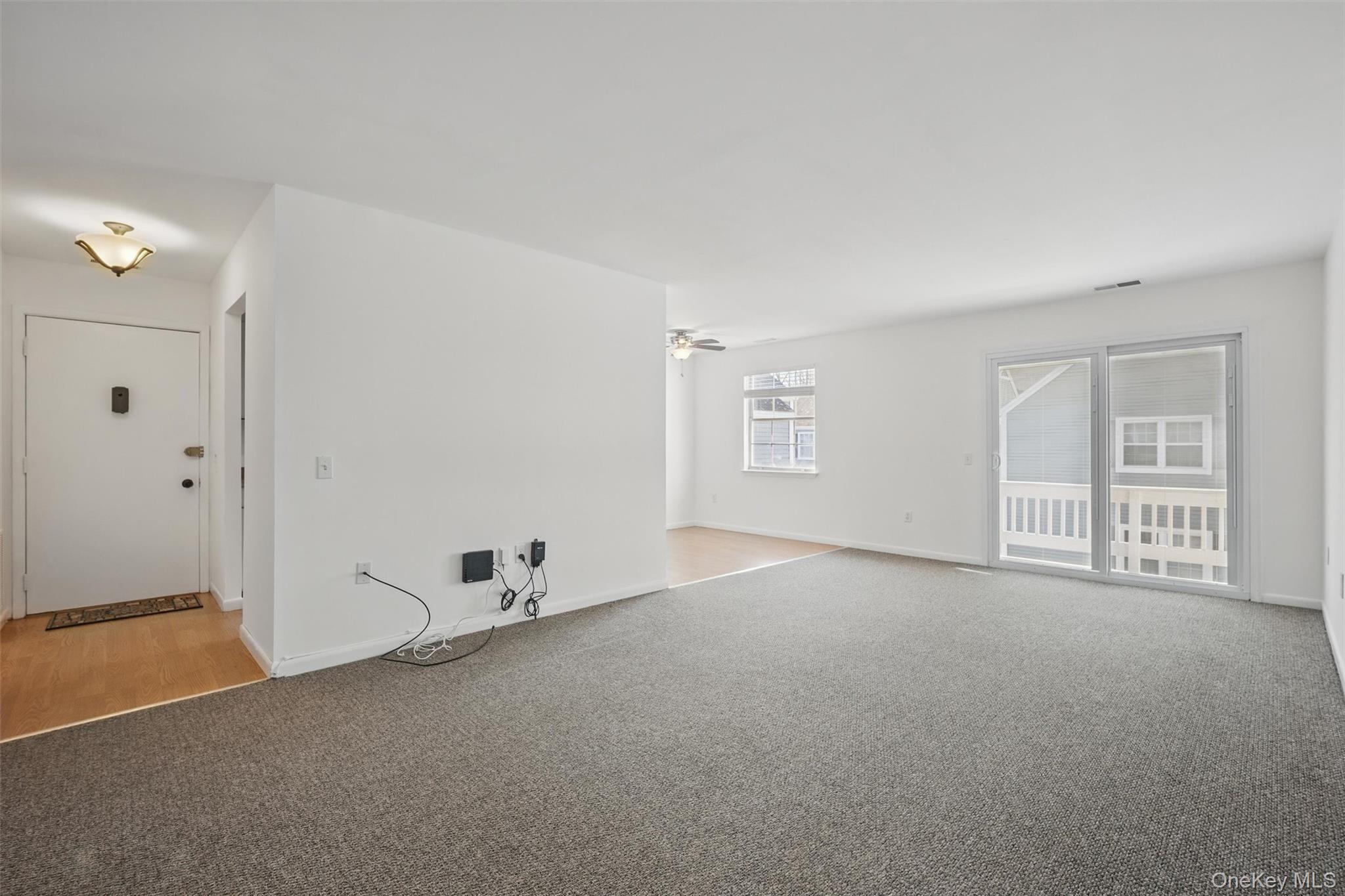 201 Commons Way, Unit E Fishkill, NY 12524 - Photo 6 of 30 an empty room with windows