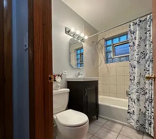 a bathroom with a toilet a sink and bathtub
