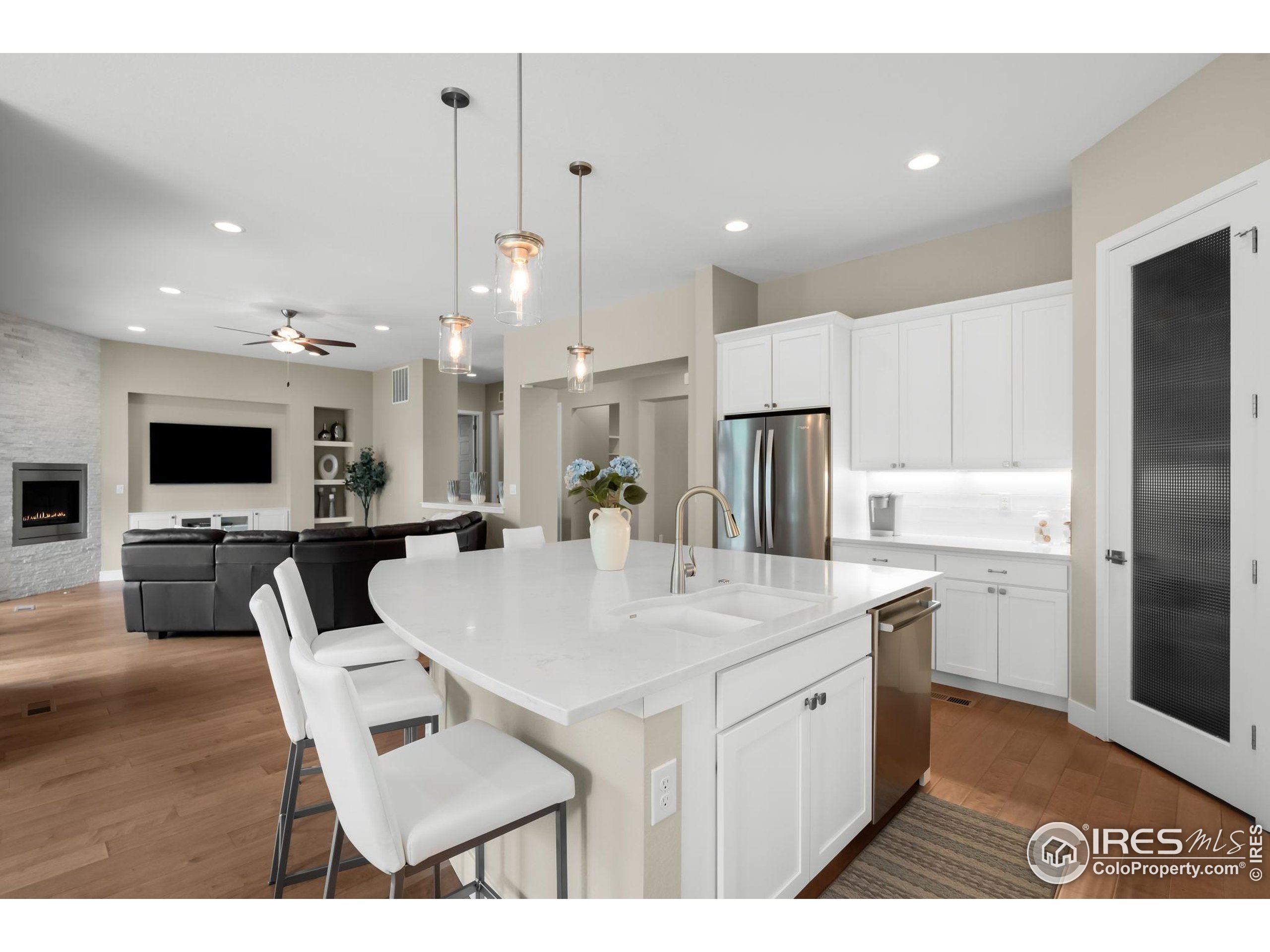 5799 Howell Street Golden, CO 80403 - Photo 11 of 50 a view of kitchen with center island and stainless steel appliances