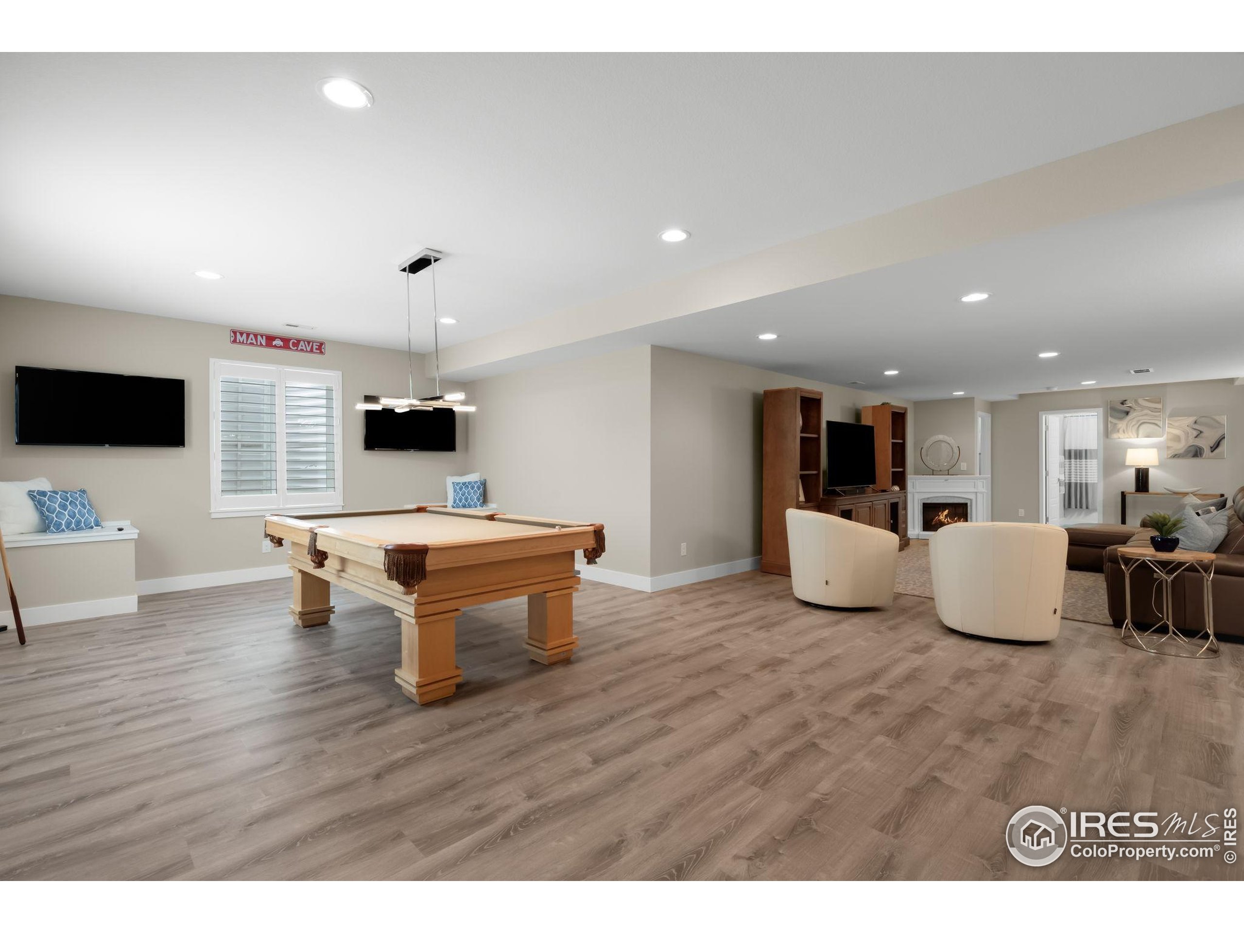 5799 Howell Street Golden, CO 80403 - Photo 15 of 50 a living room with furniture and a flat screen tv