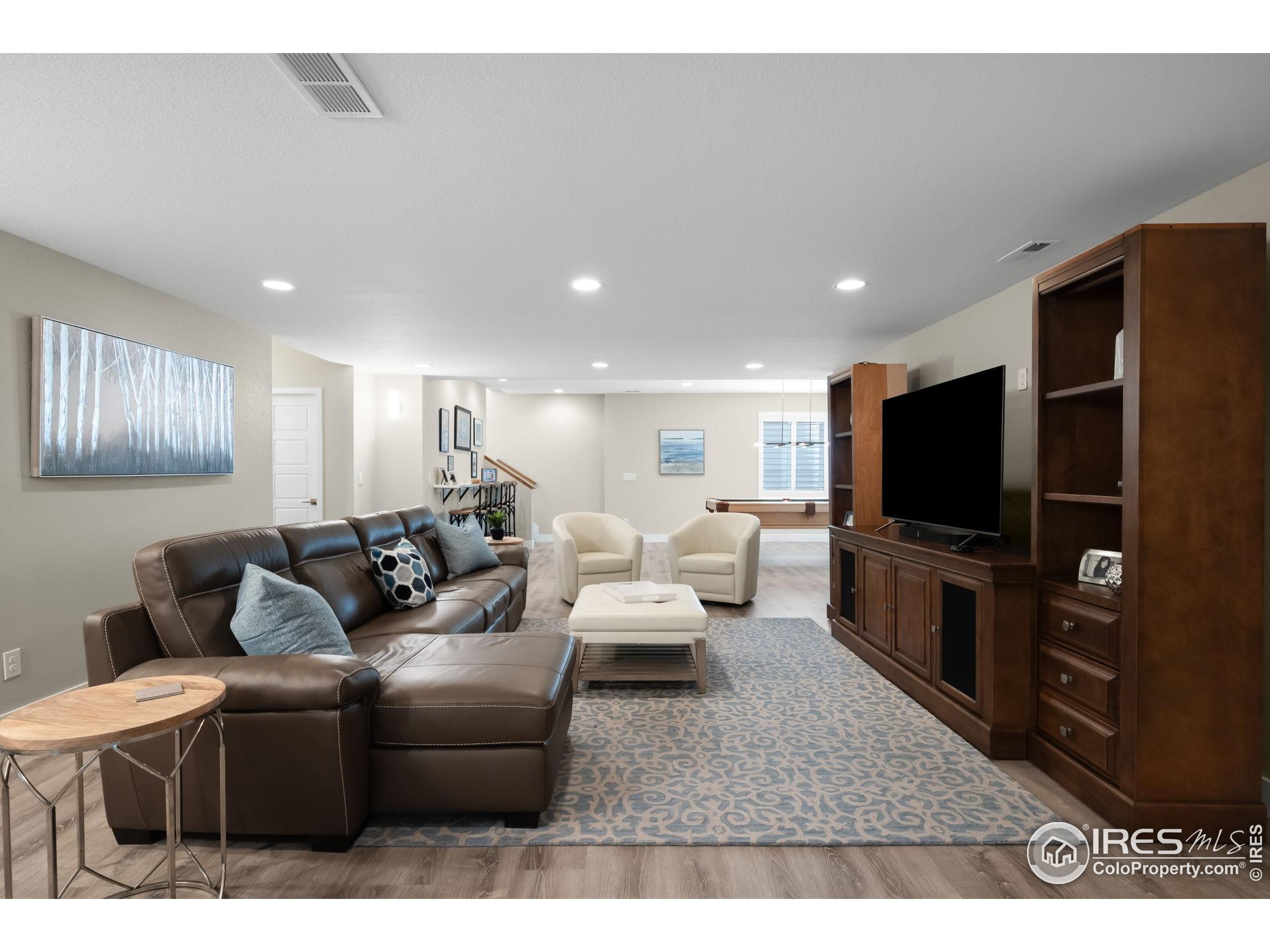5799 Howell Street Golden, CO 80403 - Photo 19 of 50 a living room with furniture and a flat screen tv