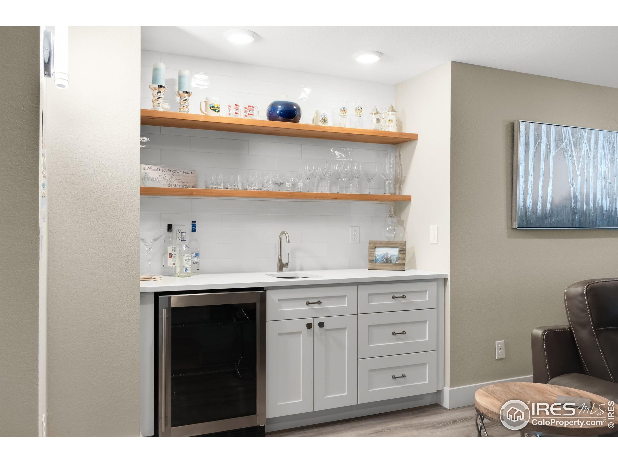 5799 Howell Street Golden, CO 80403 - Photo 20 of 50 a kitchen with a cabinets and wooden floor