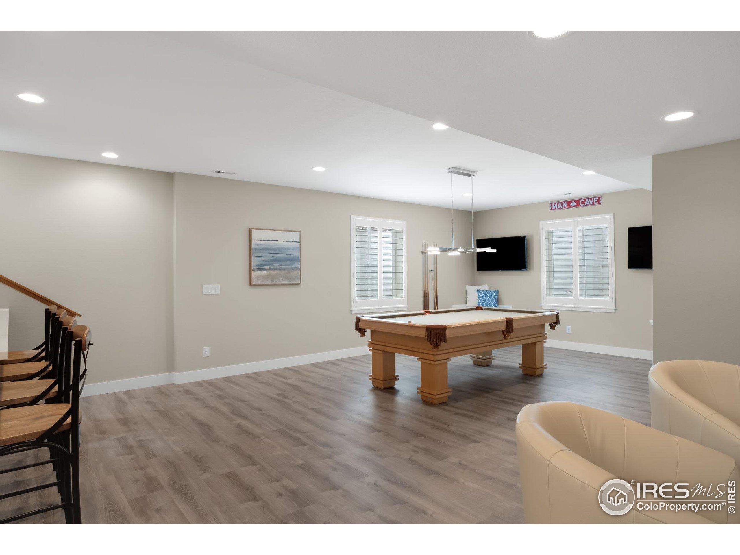 5799 Howell Street Golden, CO 80403 - Photo 24 of 50 a living room with furniture and a table