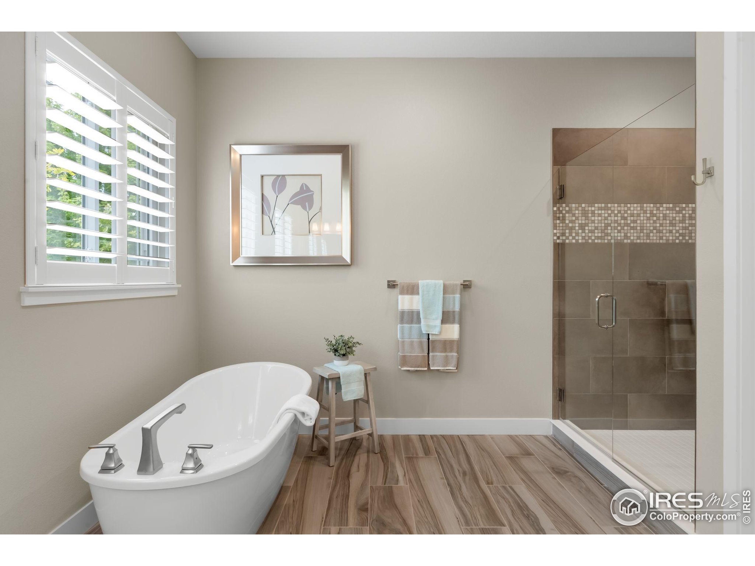 5799 Howell Street Golden, CO 80403 - Photo 31 of 50 a bathroom with a bathtub and a window