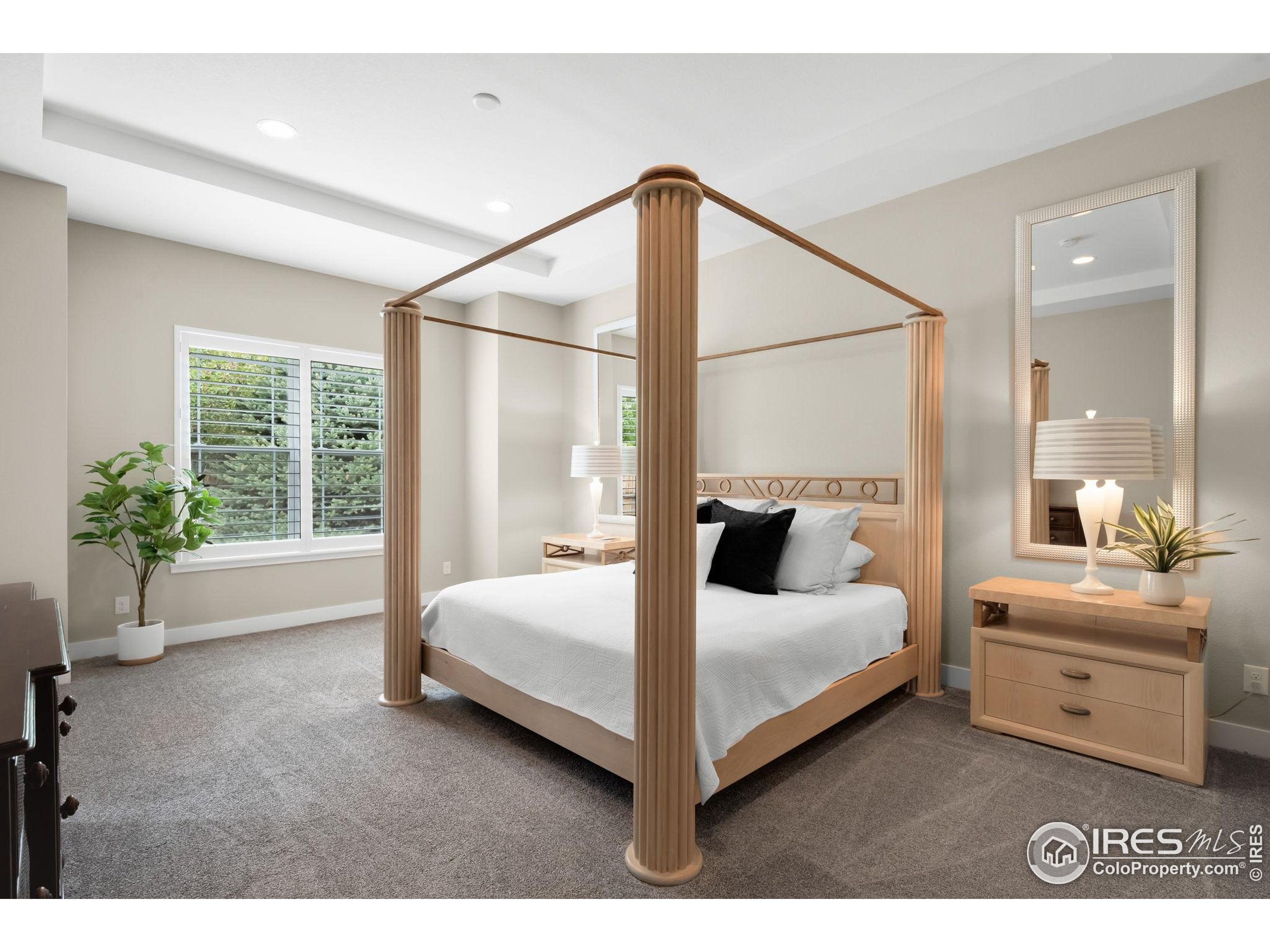 5799 Howell Street Golden, CO 80403 - Photo 33 of 50 a bedroom with a bed and a large window