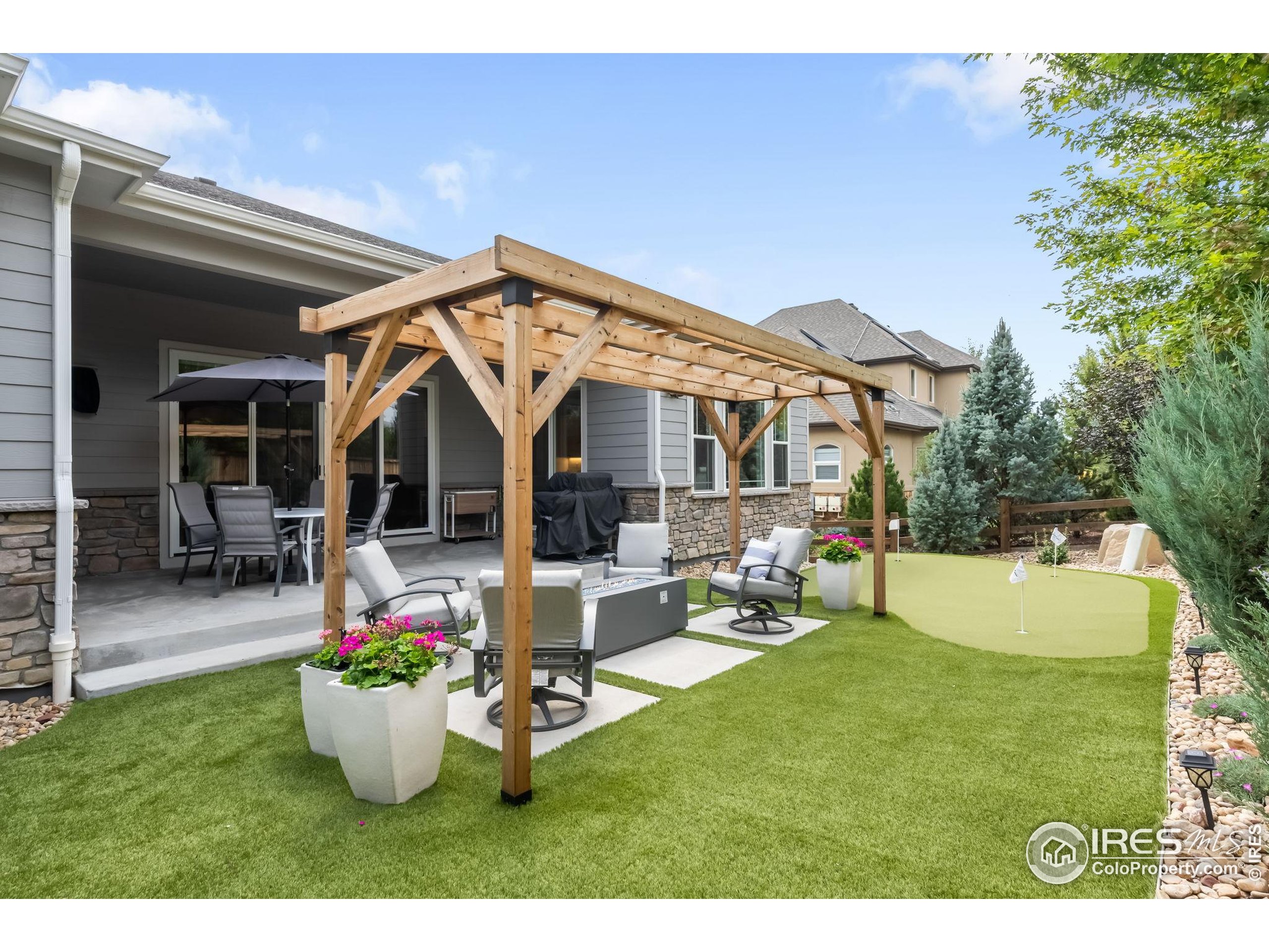 5799 Howell Street Golden, CO 80403 - Photo 39 of 50 a view of a patio with table and chairs and potted plants