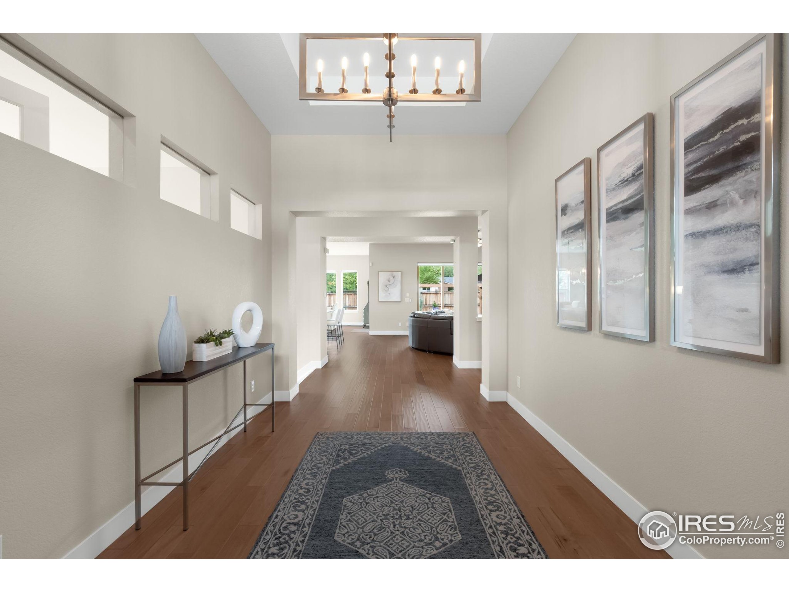 5799 Howell Street Golden, CO 80403 - Photo 4 of 50 a view of a hallway to a livingroom with furniture