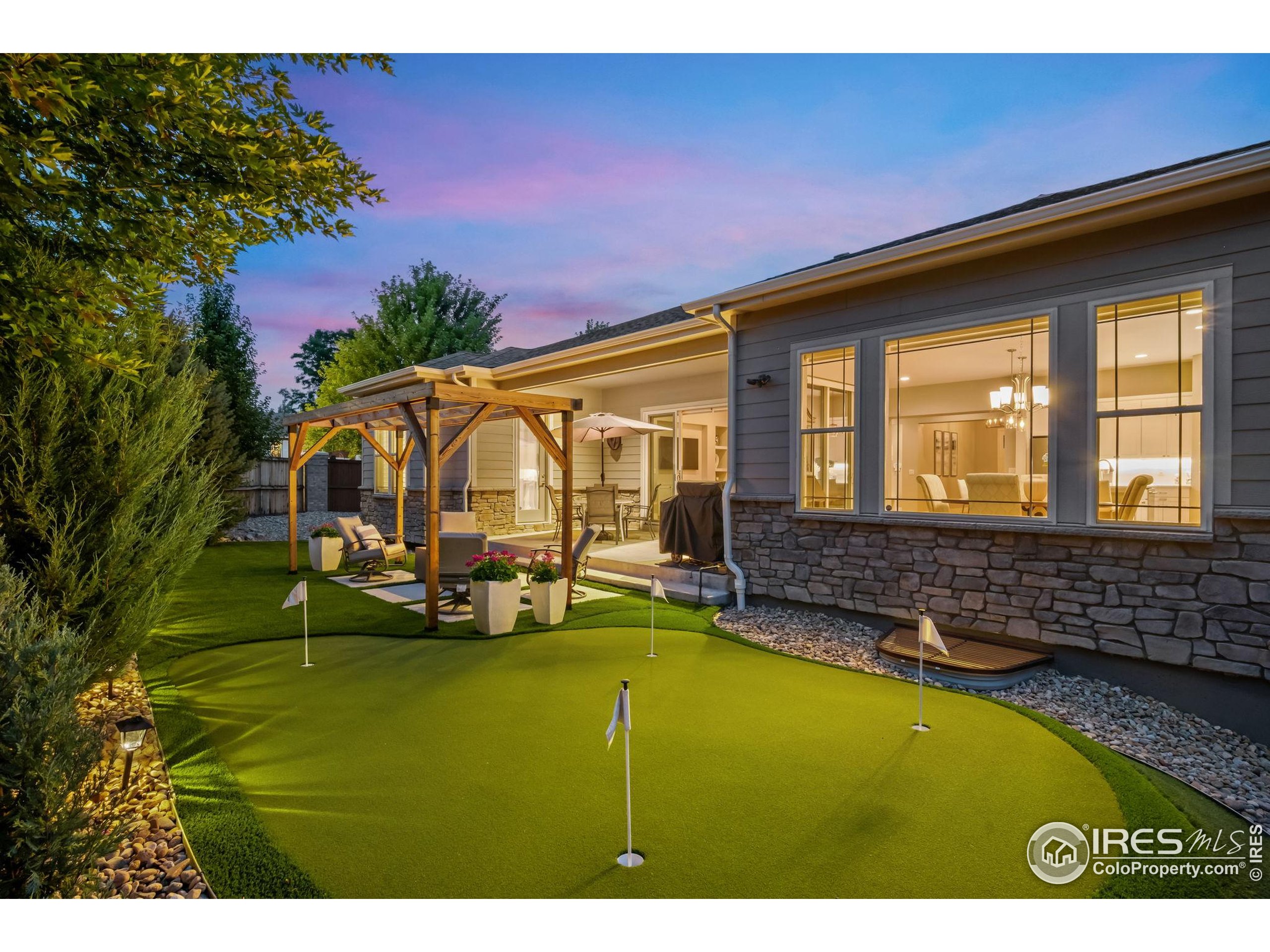 5799 Howell Street Golden, CO 80403 - Photo 41 of 50 a house view with swimming pool and sitting space