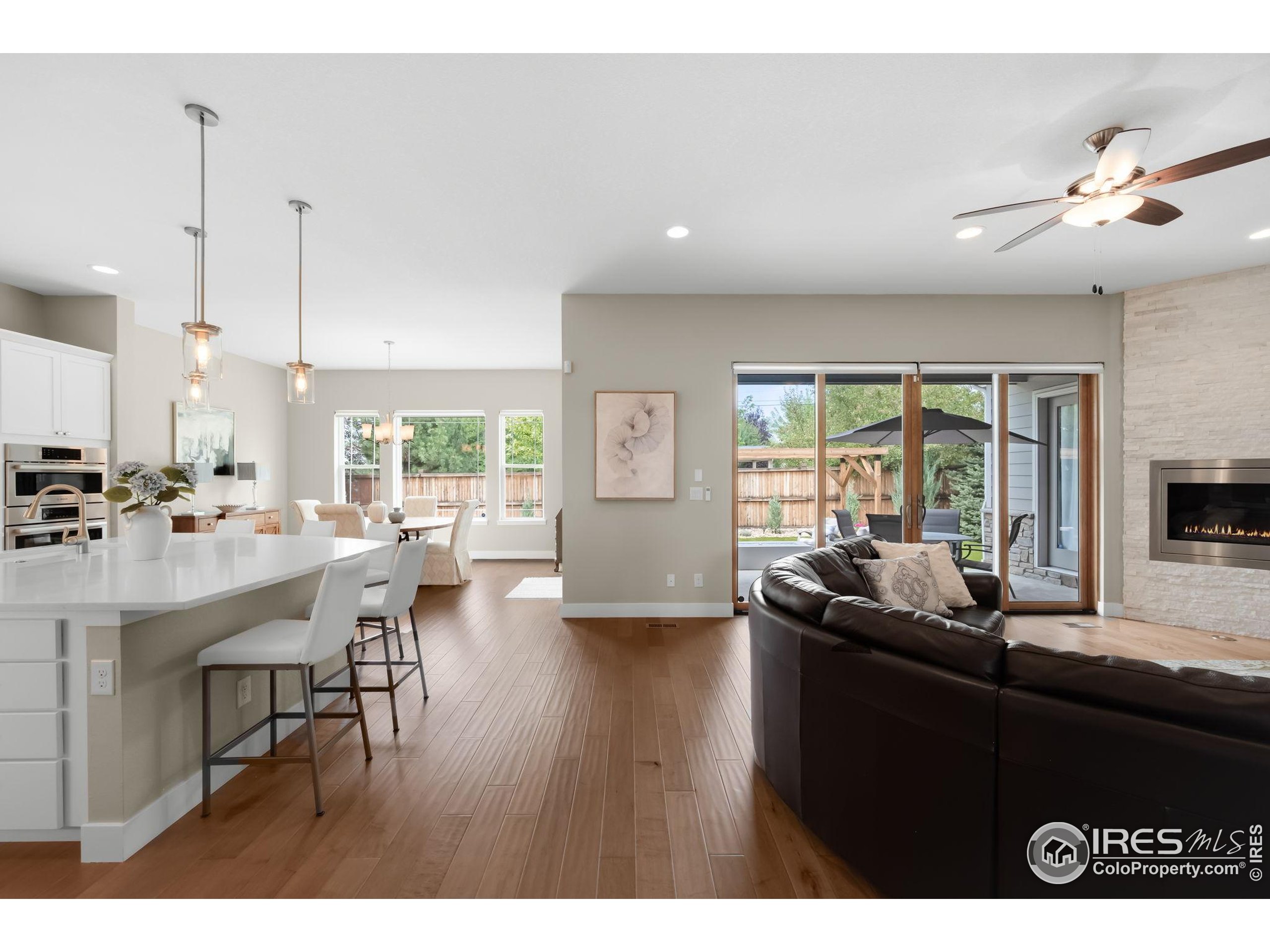 5799 Howell Street Golden, CO 80403 - Photo 5 of 50 a living room with kitchen island furniture and a large window