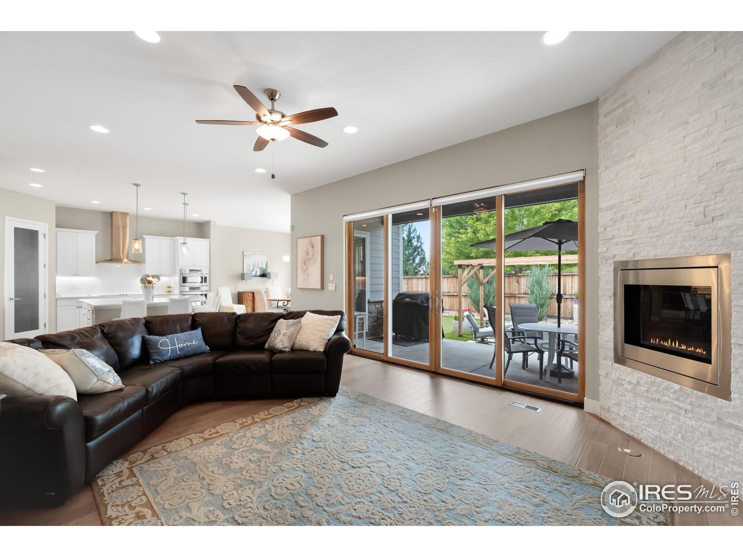 5799 Howell Street Golden, CO 80403 - Photo 6 of 50 a living room with furniture and a fireplace