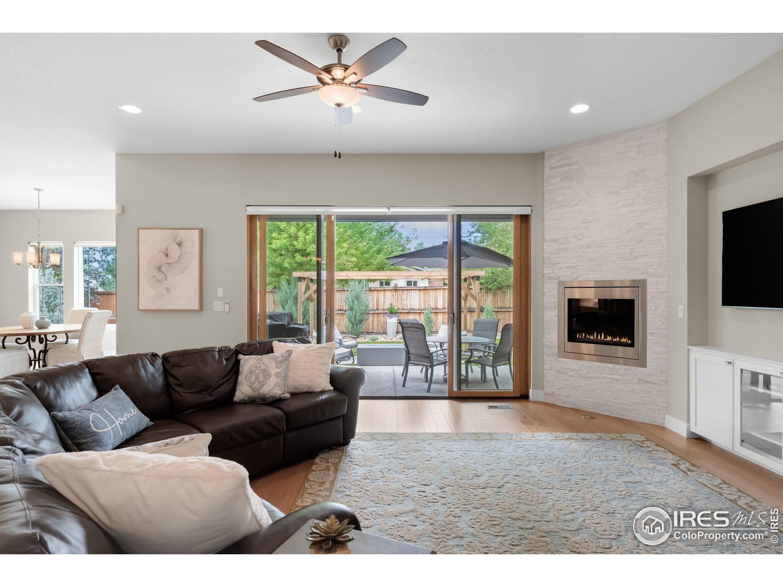 5799 Howell Street Golden, CO 80403 - Photo 8 of 50 a living room with furniture and a flat screen tv