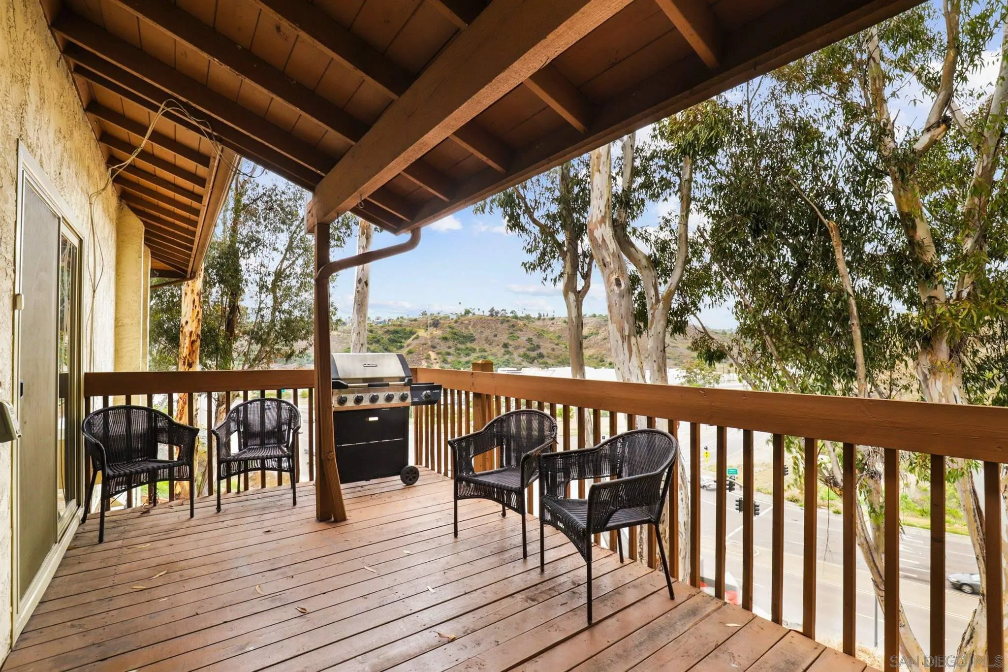 6370 Rancho Mission Road, Unit 920 San Diego, CA 92108 - Photo 13 of 22 a view of a balcony with wooden floor and furniture