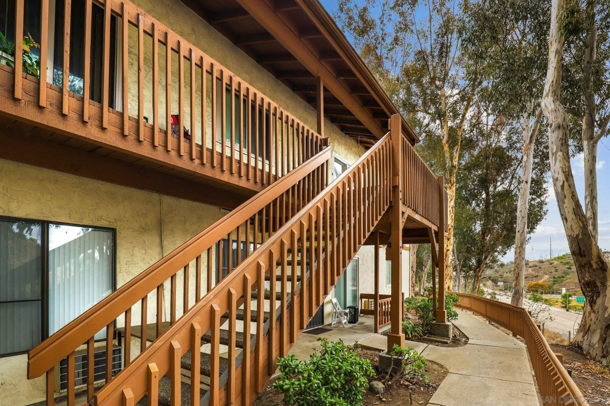 6370 Rancho Mission Road, Unit 920 San Diego, CA 92108 - Photo 14 of 22 a view of entryway with wooden stairs
