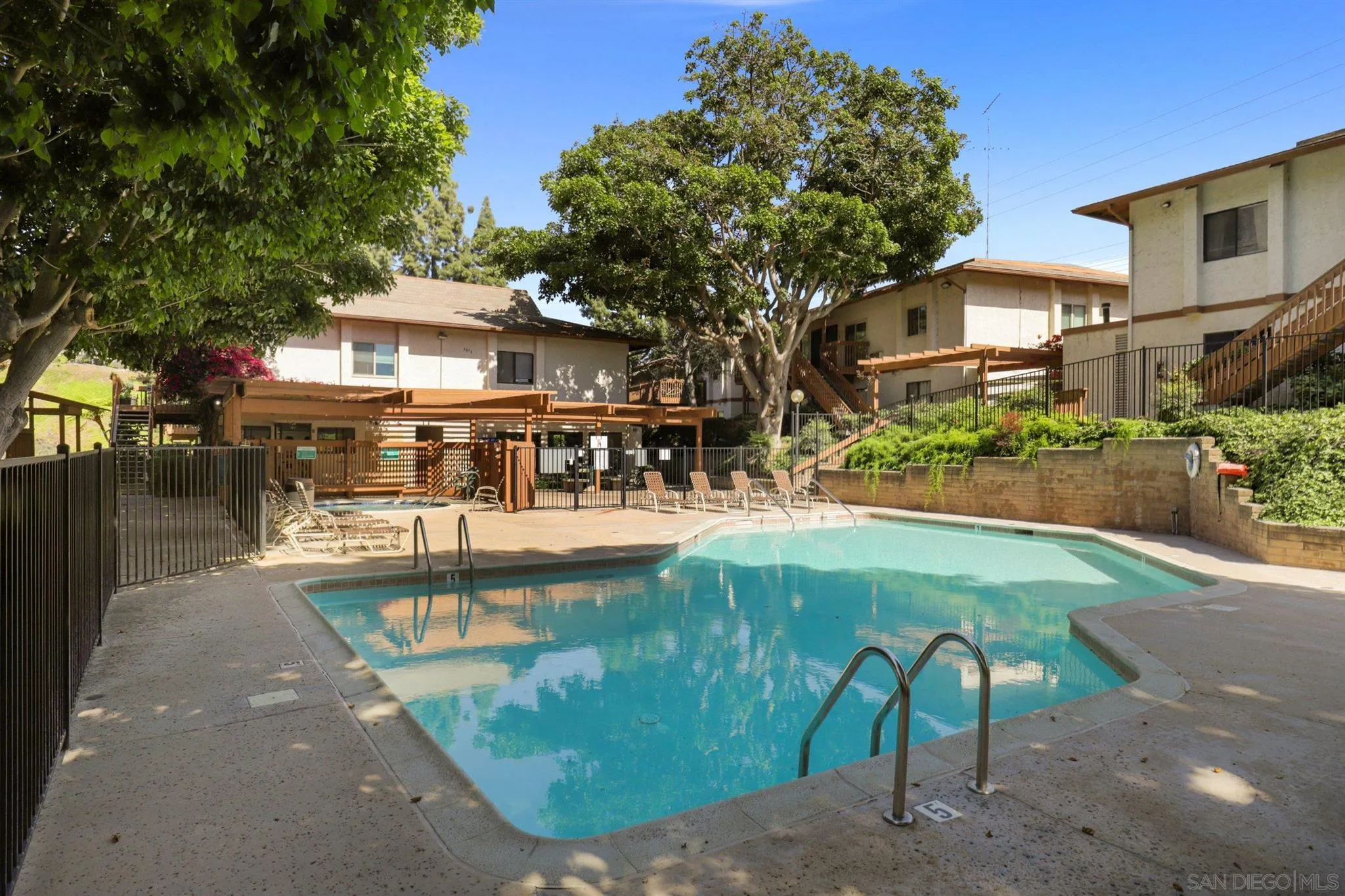 6370 Rancho Mission Road, Unit 920 San Diego, CA 92108 - Photo 16 of 22 a view of a swimming pool with a patio