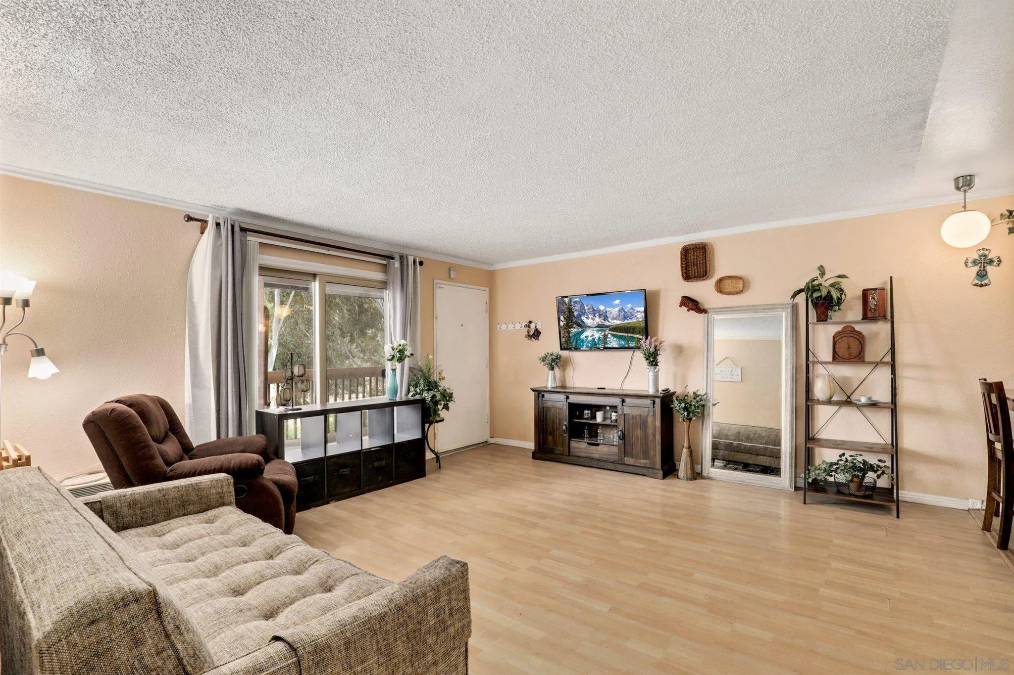 6370 Rancho Mission Road, Unit 920 San Diego, CA 92108 - Photo 3 of 22 a living room with furniture and a flat screen tv