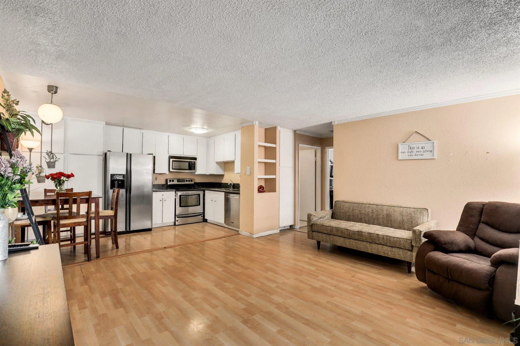 6370 Rancho Mission Road, Unit 920 San Diego, CA 92108 - Photo 8 of 22 a living room with furniture and kitchen view