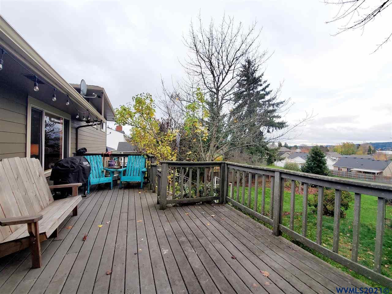 231 Northwest Reed Lane Dallas, OR 97338 - Photo 27 of 41 a view of a balcony with chairs and wooden floor