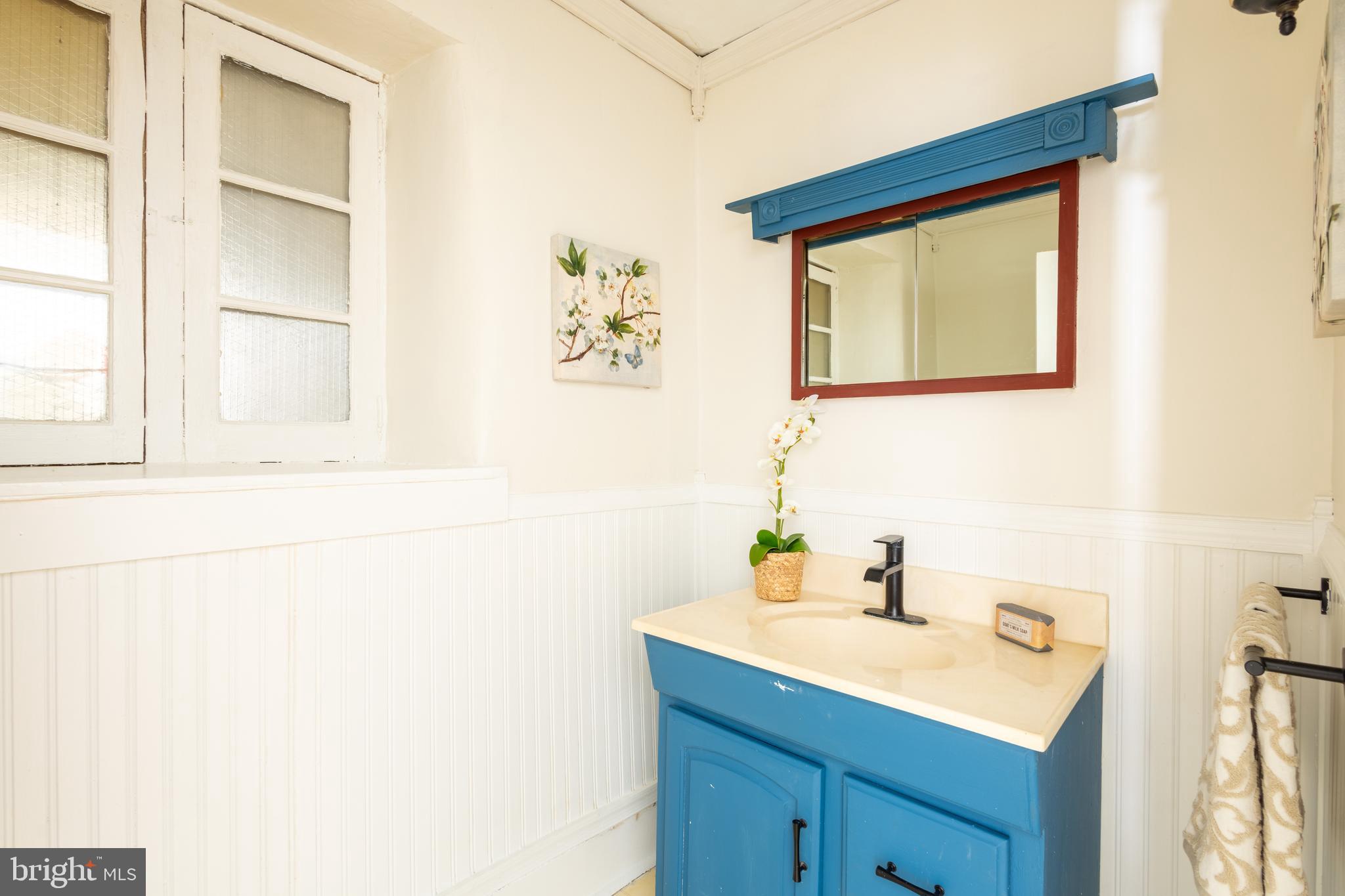 1301 Stump Road North Wales, PA 19454 - Photo 11 of 19 a bathroom with a sink a vanity and a window